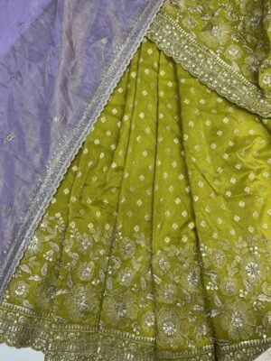 Tissue Lehenga with all over botta with Zari border self blouse along contrast Duppata with cut work