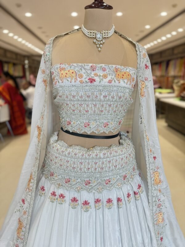 Tissue lehenga with all over botti along with heavy  border with self blouse with self dupatta with cut work border (full set) - Image 2