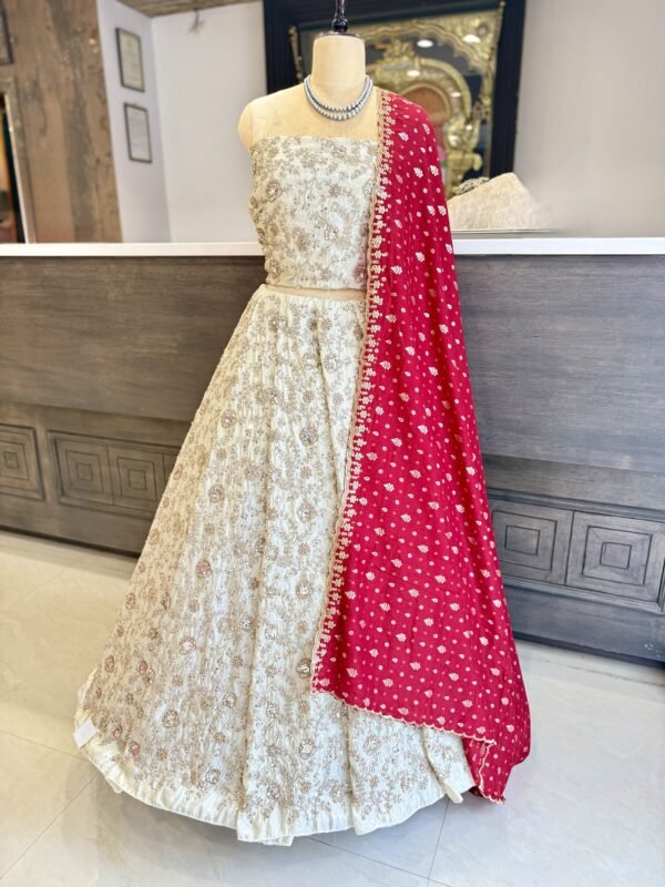 Tissue Lehenga and blouse along with all over kardana and copper seqance work along with contrast bandini cut work dupatta (full set)